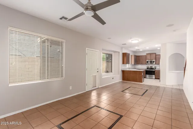 a view of a kitchen with furniture and a window