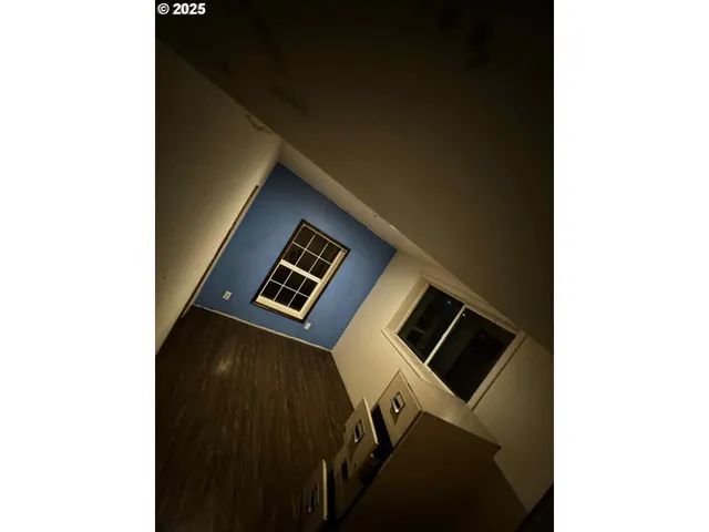 a view of a hallway with front door