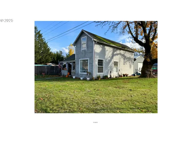 a black and white photo of a house