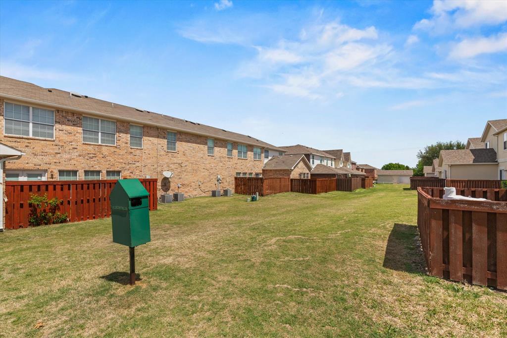 706 South Jupiter Road, Unit 1101 Allen, TX 75002 - Photo 27 of 31 a front view of a house with a yard