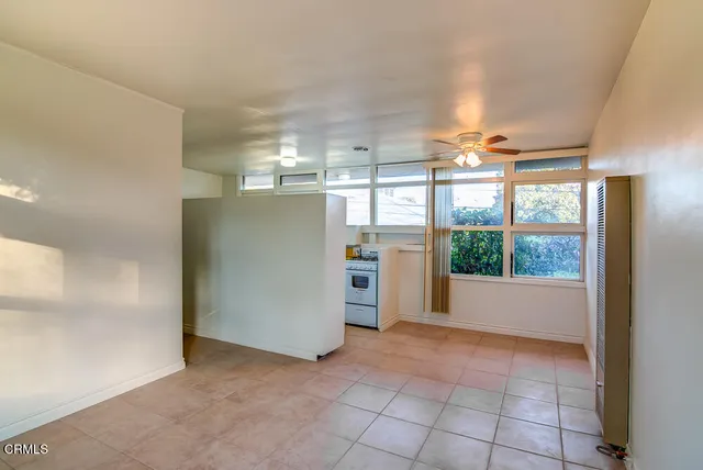 a view of a room with a open kitchen