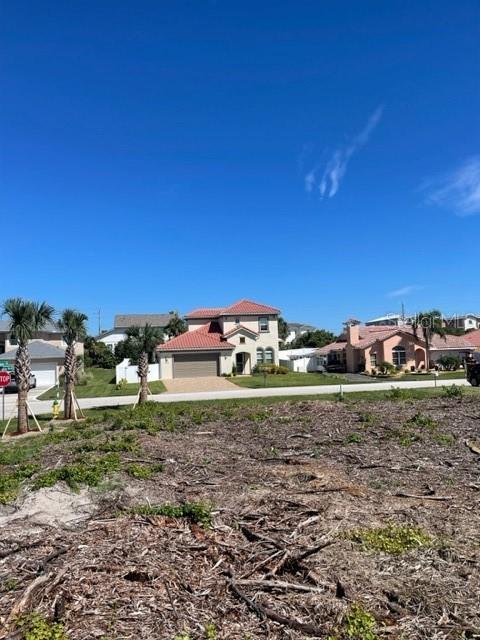 4734 Riverglen Boulevard Ponce Inlet, FL 32127 - Photo 11 of 24 a view of a building with a yard
