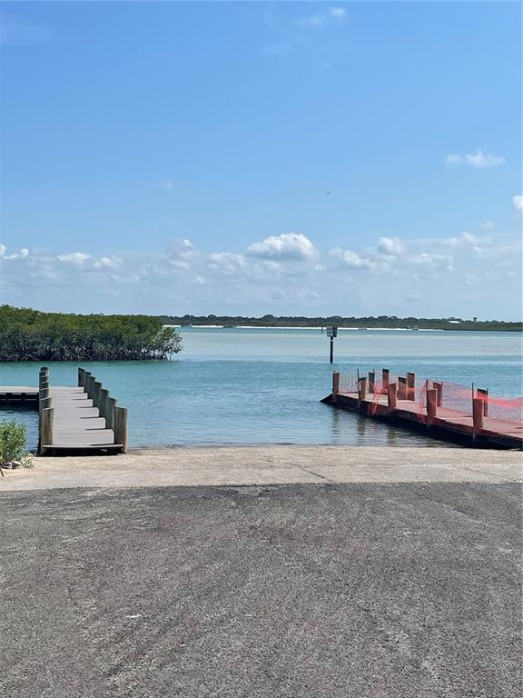 4734 Riverglen Boulevard Ponce Inlet, FL 32127 - Photo 14 of 24 a view of a lake with mountain in the background