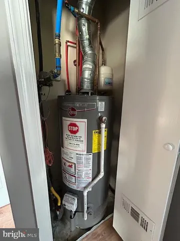 a bedroom with a bed and a night stand