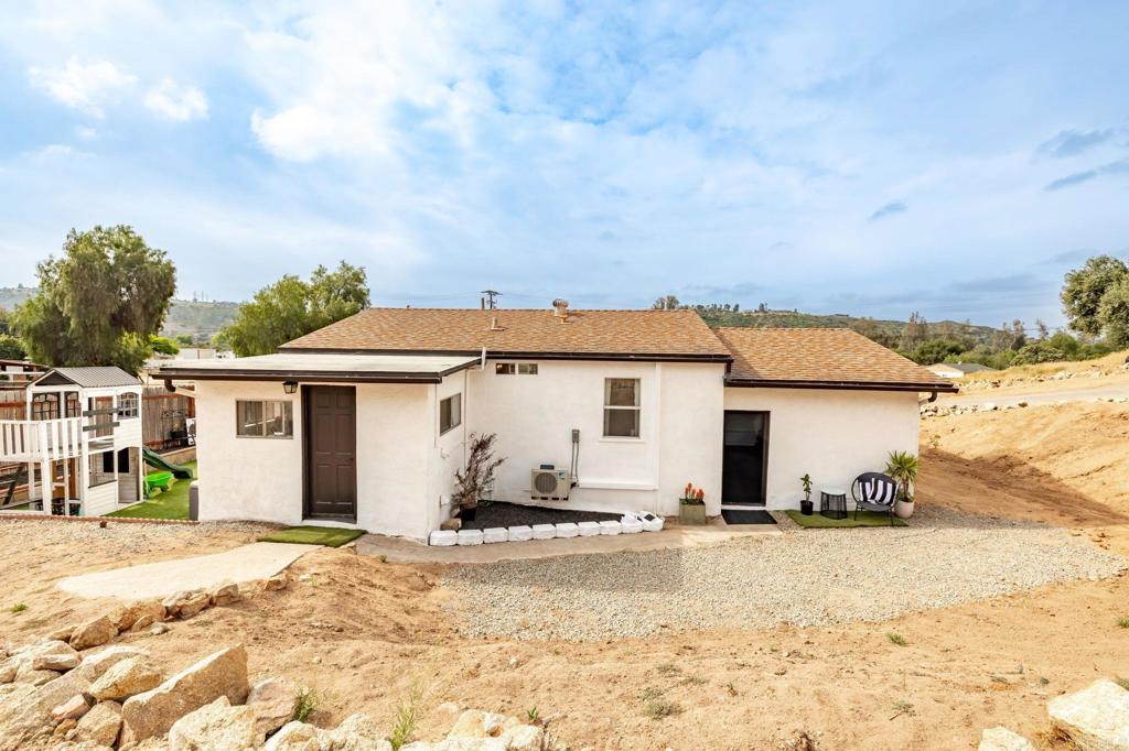 13510 Willow Road Lakeside, CA 92040 - Photo 16 of 35 View from the Barn back toward the back door entry to the home and door leading to the 1-Car Garage