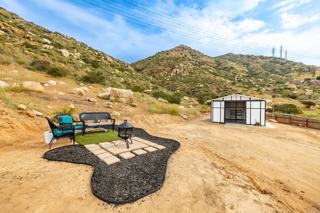 13510 Willow Road Lakeside, CA 92040 - Photo 18 of 35 View from the sitting area toward the barn. Lot ends aprox 600 feet up the hillside (walking trails)