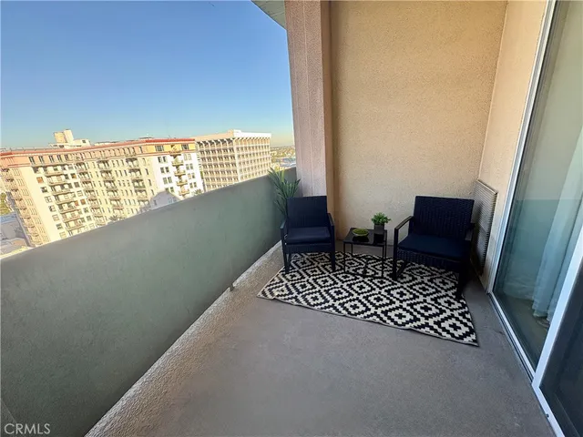 a view of a balcony with chair and front door