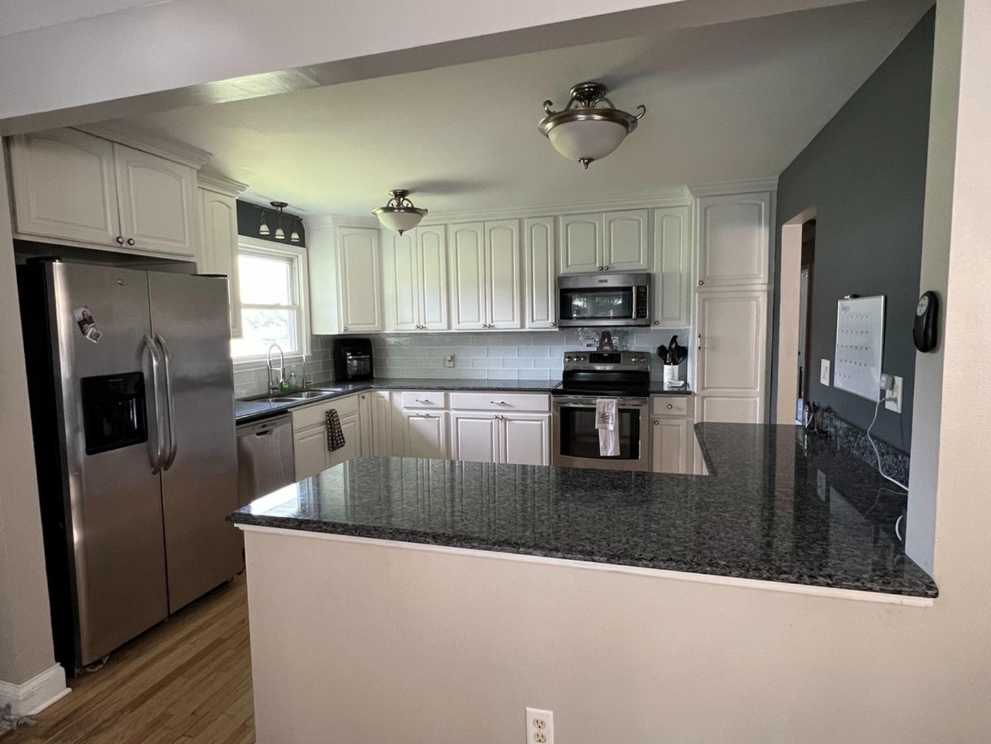 43W760 Rowe Road Elburn, IL 60119 - Photo 2 of 19 a kitchen with stainless steel appliances granite countertop a refrigerator a stove top oven a sink and dishwasher