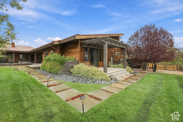 5936 Triple Crown Trail Oakley, UT 84055 - Photo 34 of 57 Wood-sided exterior featuring a metal roof and an expansive deck