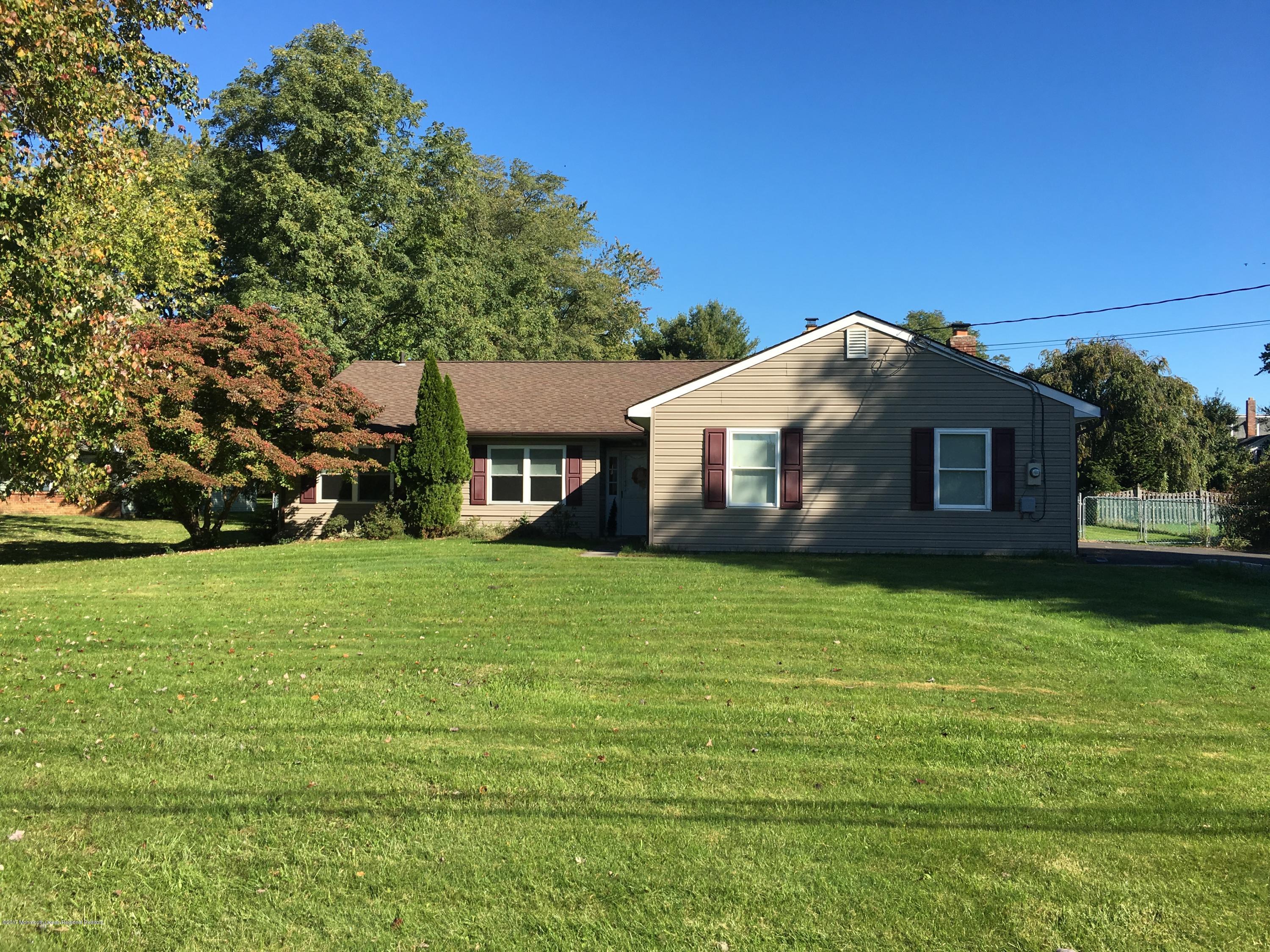 10 Fenimore Road Freehold, NJ 07728 - Photo 1 of 36 a front view of a house with a garden