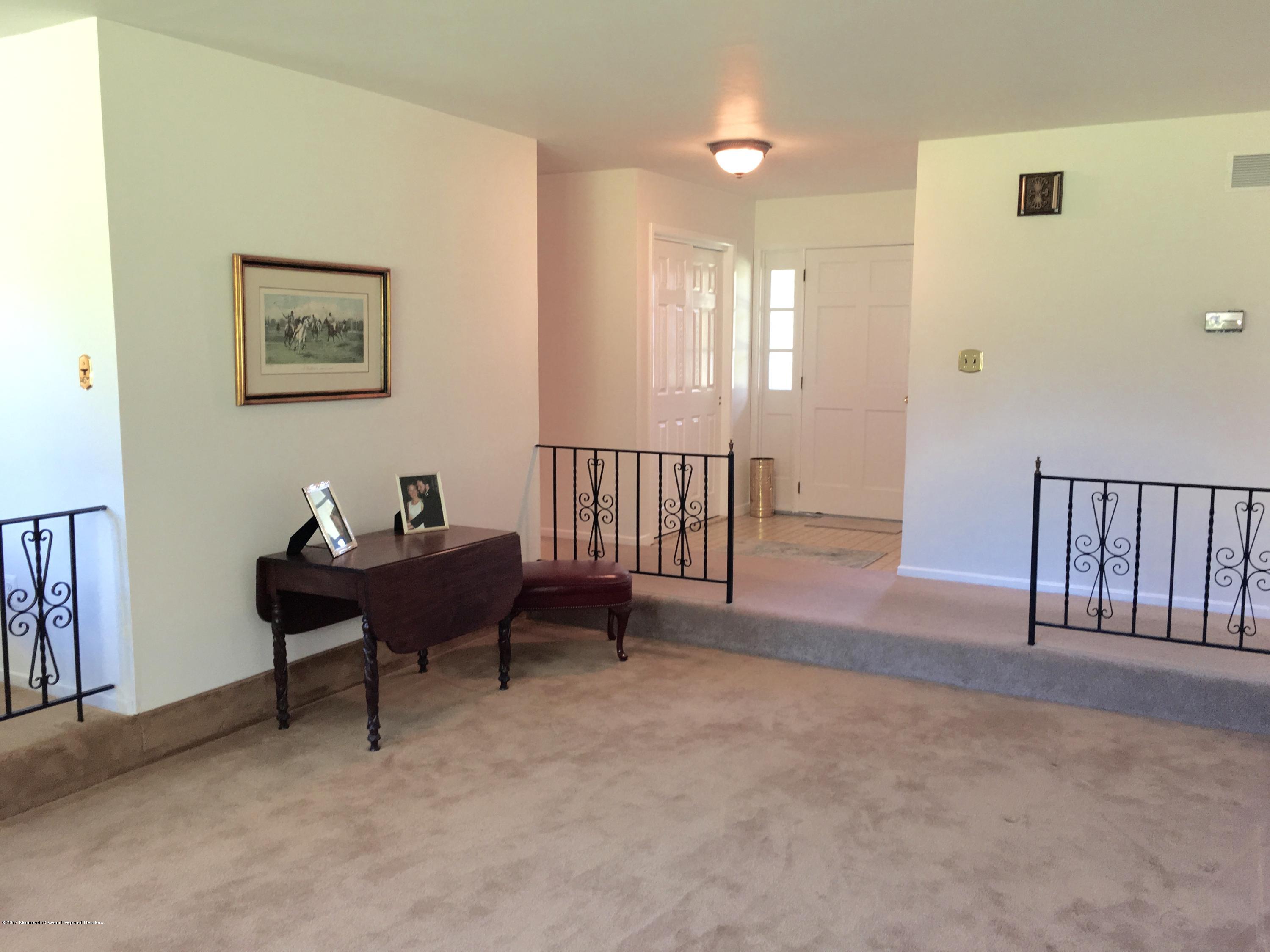10 Fenimore Road Freehold, NJ 07728 - Photo 13 of 36 a living room with furniture and a window