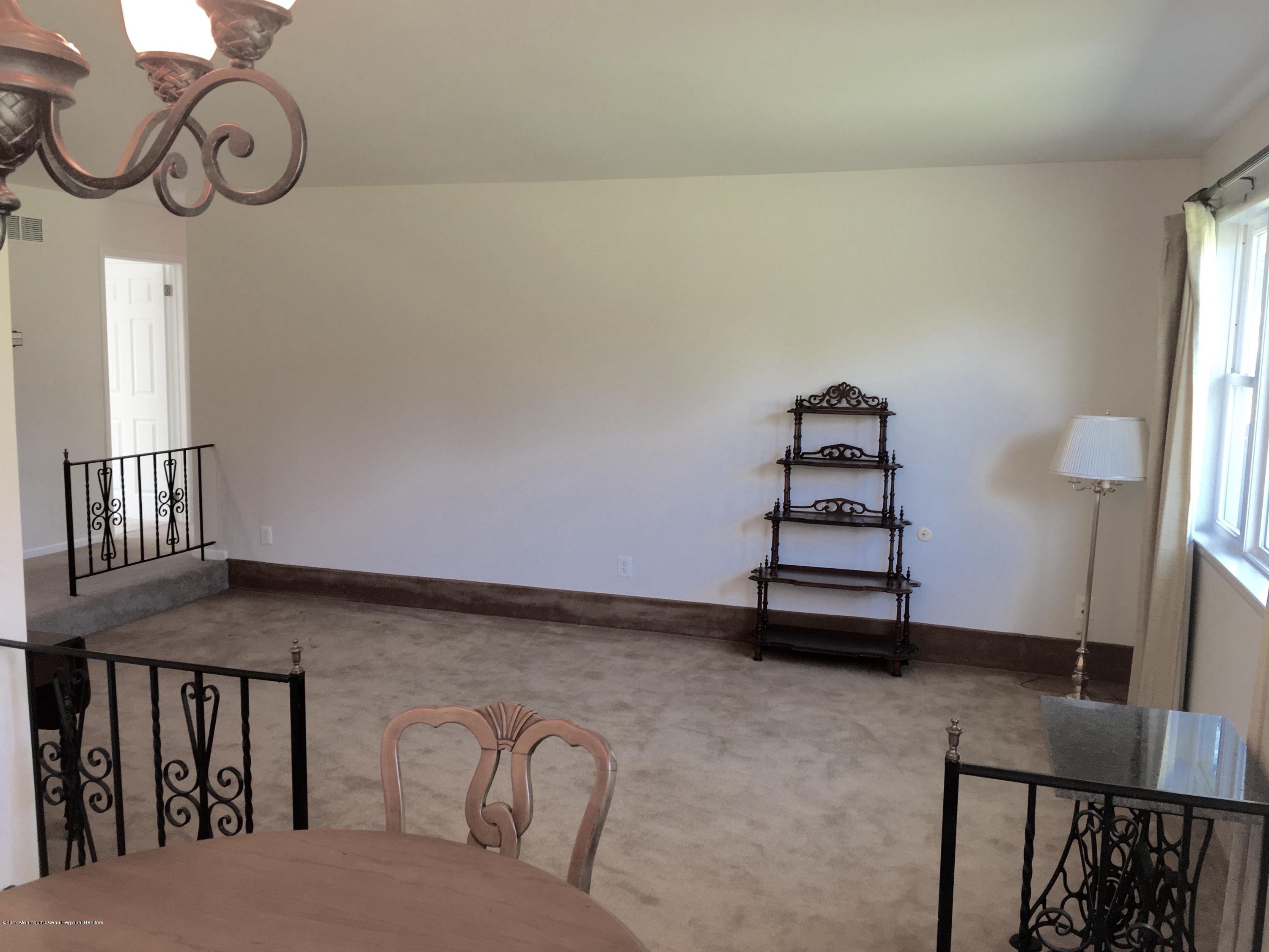 10 Fenimore Road Freehold, NJ 07728 - Photo 2 of 36 a view of entryway with stairs and furniture
