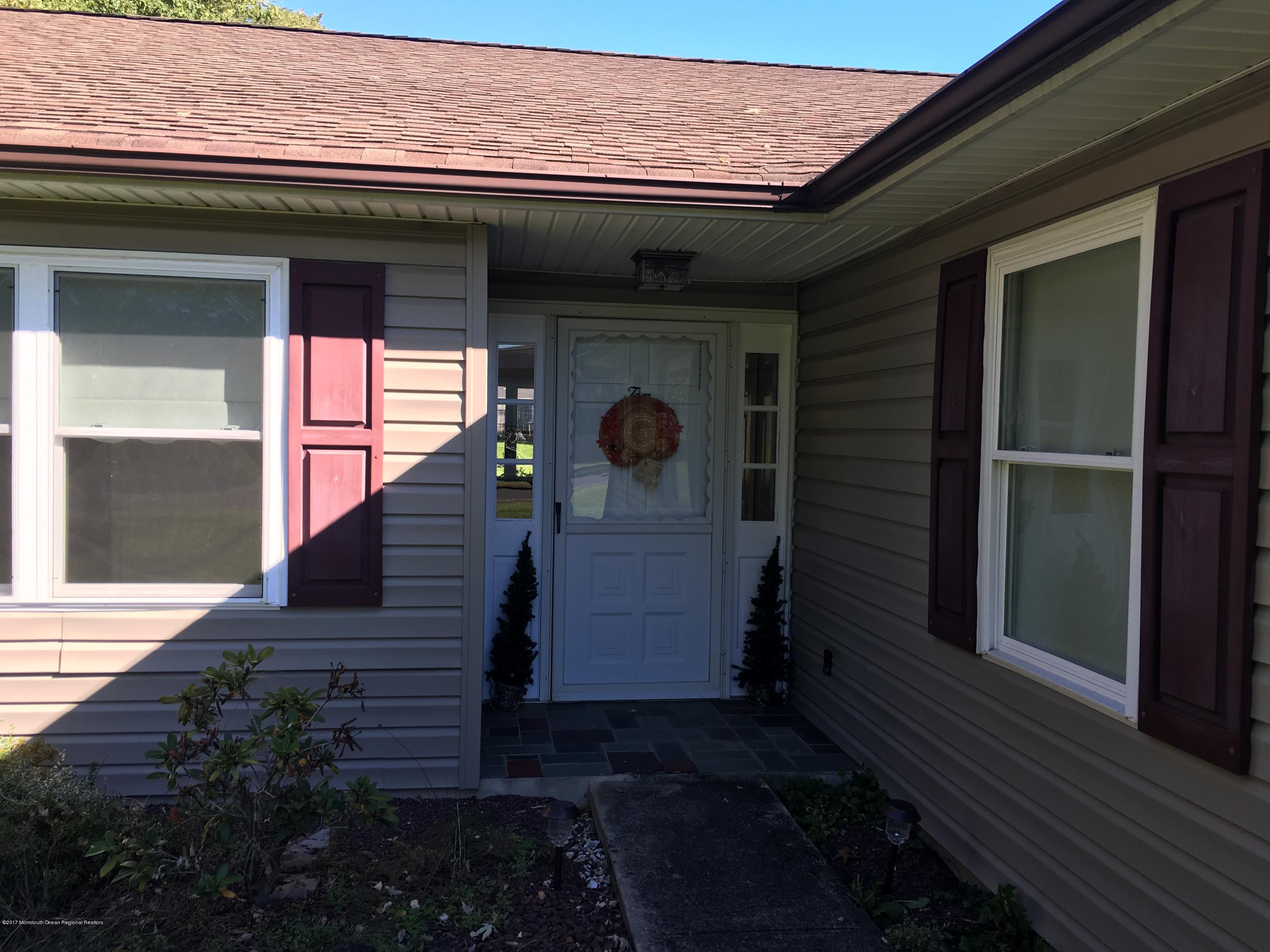 10 Fenimore Road Freehold, NJ 07728 - Photo 29 of 36 a view of a porch of the house
