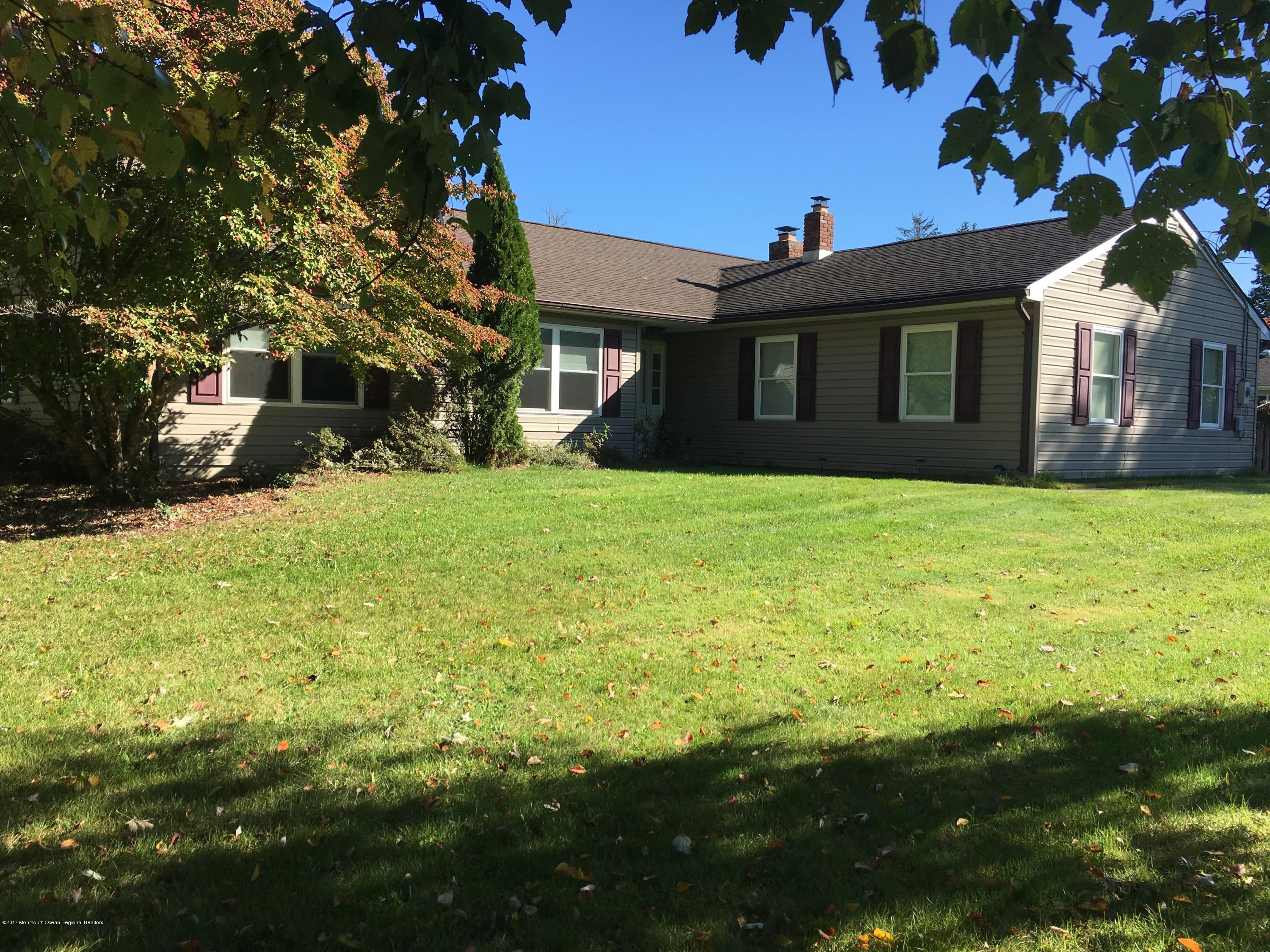10 Fenimore Road Freehold, NJ 07728 - Photo 30 of 36 a view of a house with a yard