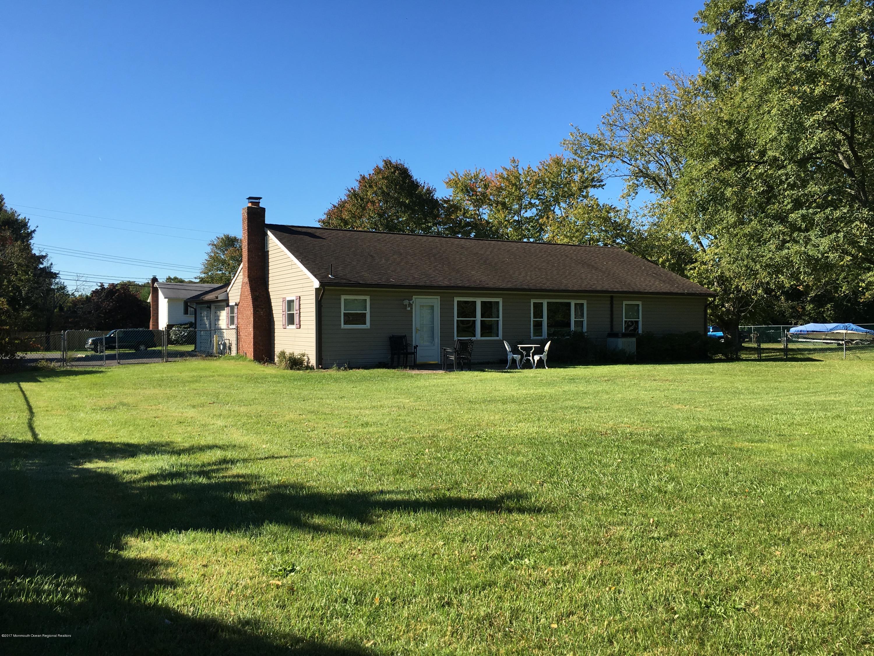 10 Fenimore Road Freehold, NJ 07728 - Photo 34 of 36 a front view of a house with a yard