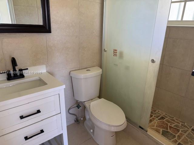 29325 Southwest 182nd Avenue Homestead, FL 33030 - Photo 13 of 21 a white toilet sitting next to a bathroom sink and vanity