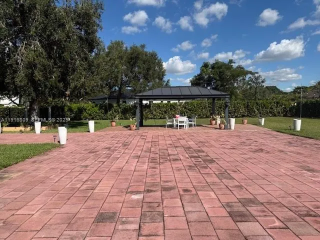 a street view with pathway both of side with yard