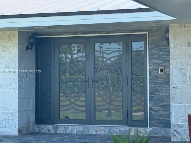 a bathroom with a shower and a sink