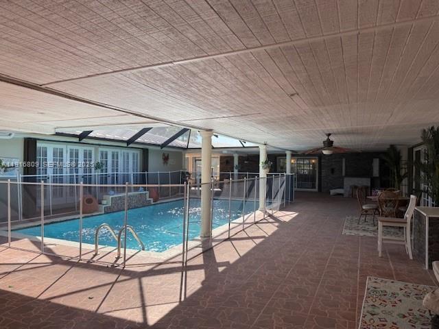 29325 Southwest 182nd Avenue Homestead, FL 33030 - Photo 9 of 21 a view of a patio with table and chairs with wooden floor and fence