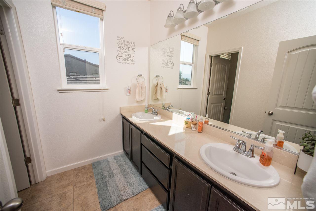 1930 Tawleed Road Reno, NV 89521 - Photo 12 of 28 a bathroom with a sink and a mirror