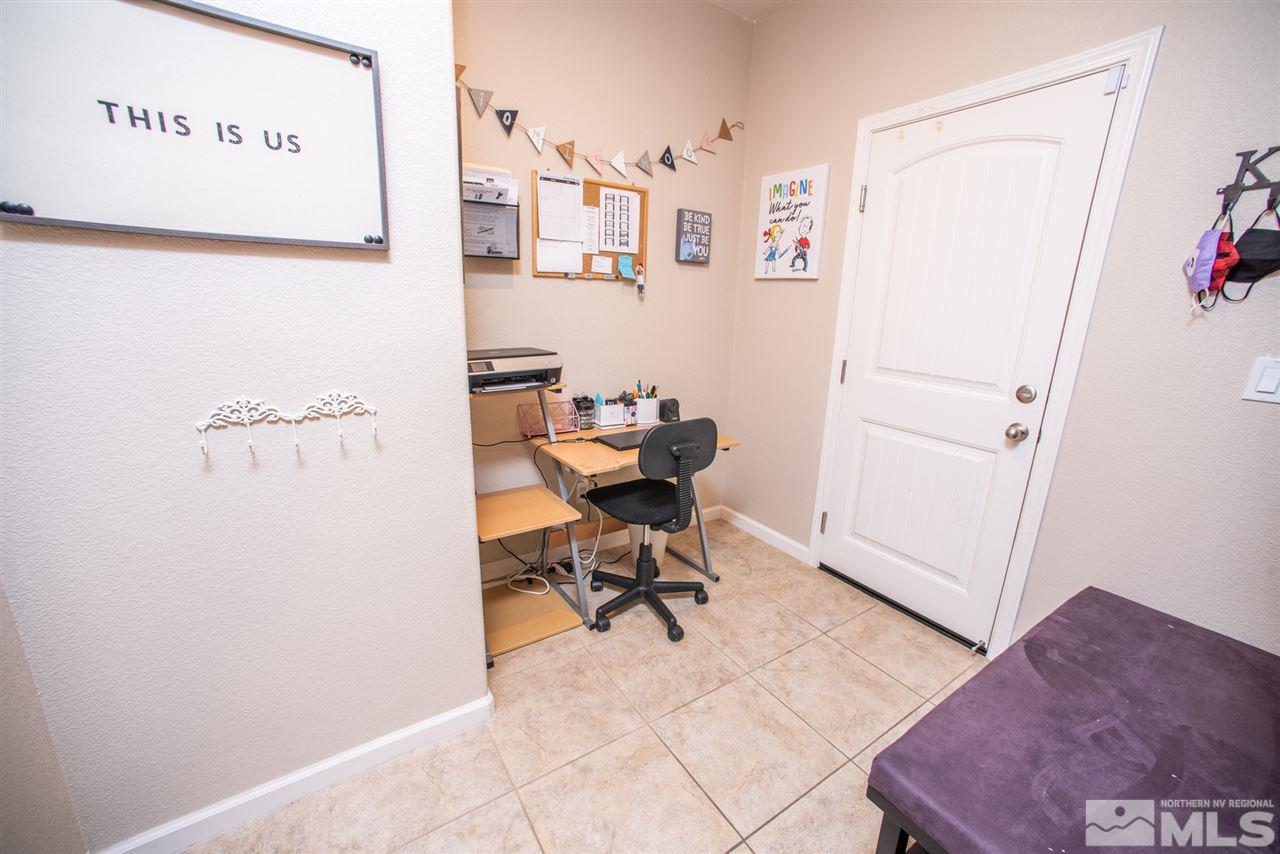 1930 Tawleed Road Reno, NV 89521 - Photo 21 of 28 a view of a workspace with furniture and a window