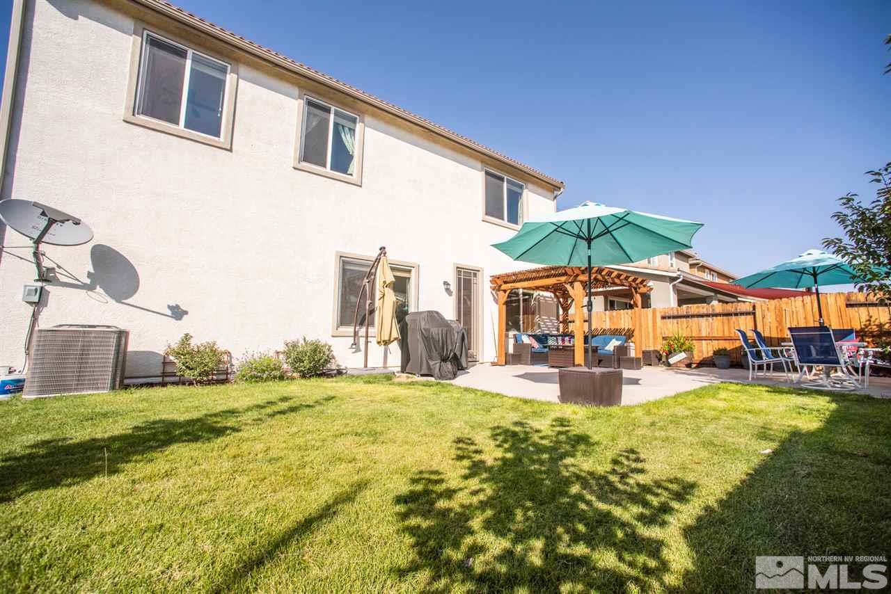 1930 Tawleed Road Reno, NV 89521 - Photo 23 of 28 a view of a house with swimming pool and sitting area