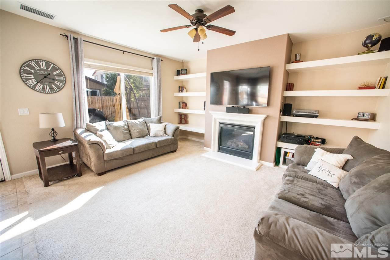 1930 Tawleed Road Reno, NV 89521 - Photo 4 of 28 a living room with furniture and a fireplace