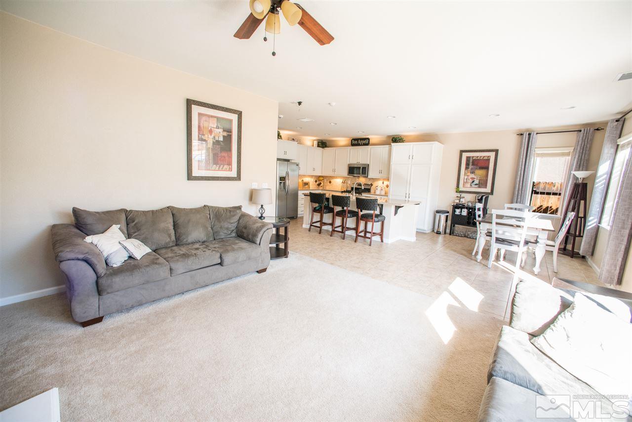 1930 Tawleed Road Reno, NV 89521 - Photo 5 of 28 a living room with furniture and a dining table with kitchen view