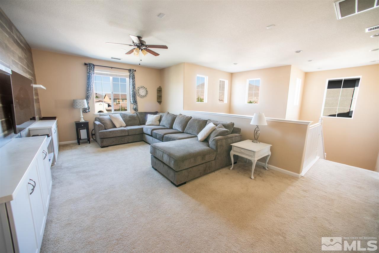 1930 Tawleed Road Reno, NV 89521 - Photo 9 of 28 a living room with furniture and a flat screen tv