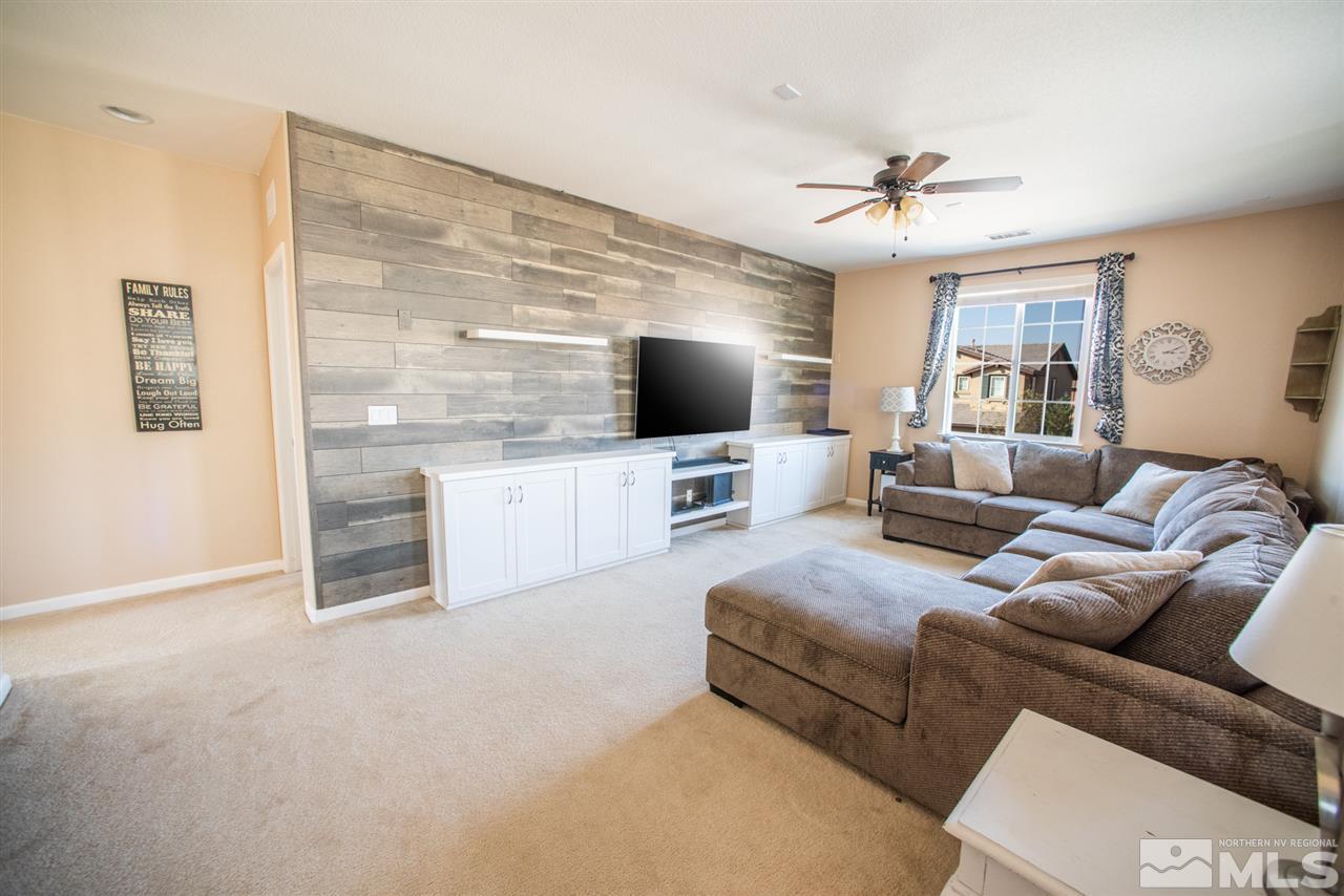 1930 Tawleed Road Reno, NV 89521 - Photo 10 of 28 a living room with furniture and a flat screen tv