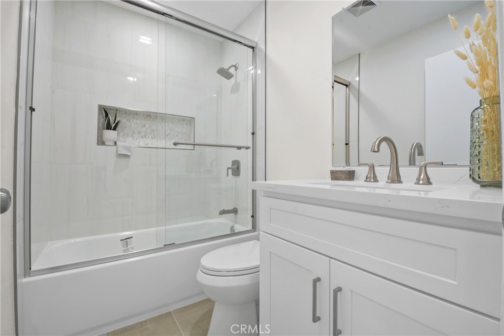921 Boon Place, Unit A Corona, CA 92881 - Photo 16 of 21 a bathroom with a sink a toilet and shower