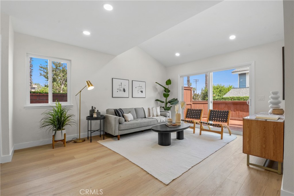 921 Boon Place, Unit A Corona, CA 92881 - Photo 4 of 21 a living room with furniture potted plant and a large window