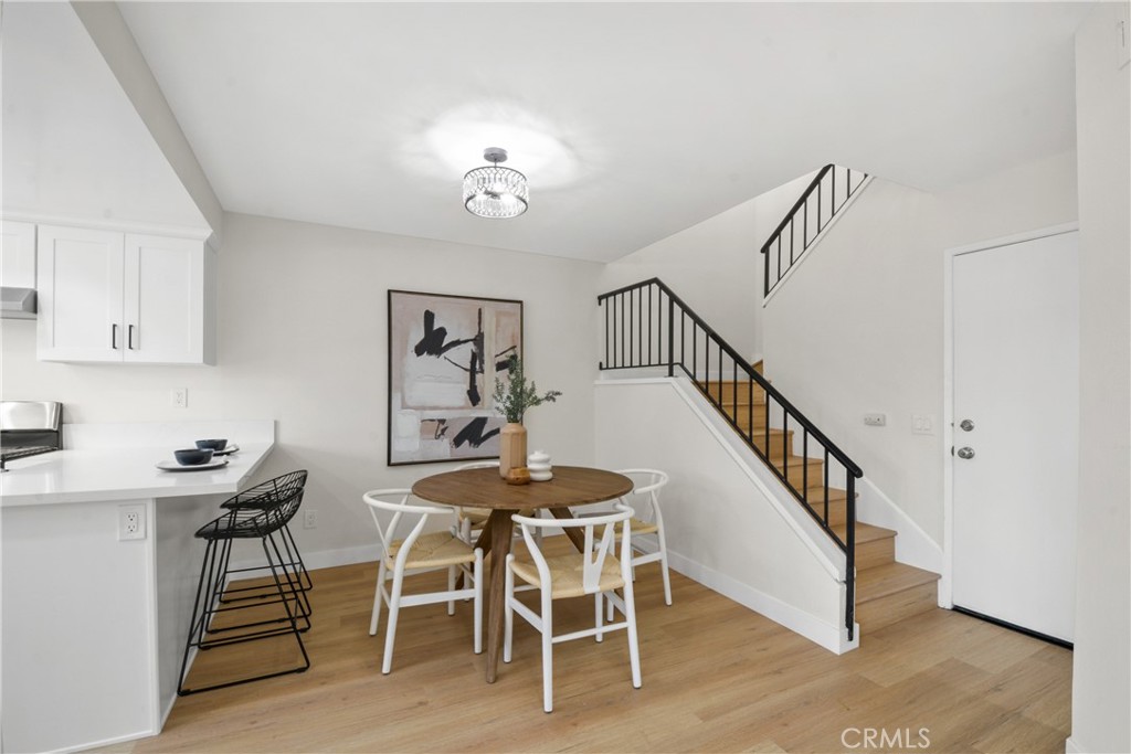 921 Boon Place, Unit A Corona, CA 92881 - Photo 5 of 21 a view of a dining room with furniture and wooden floor