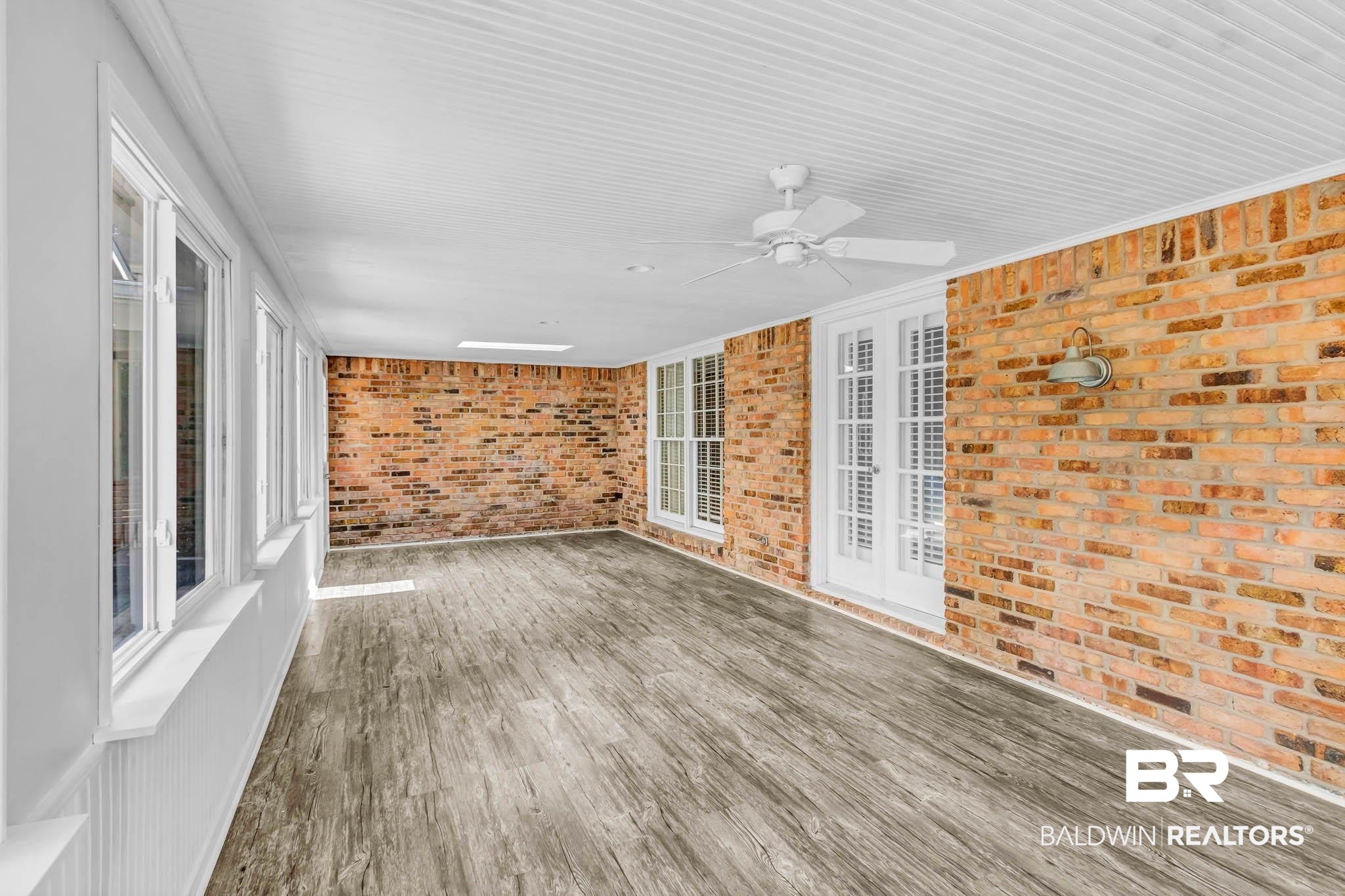 309 West Brandy Run Road Mobile, AL 36608 - Photo 75 of 100 Unfurnished sunroom with a ceiling fan