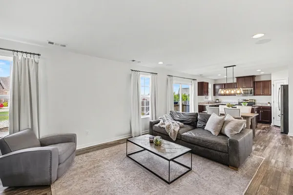a living room with furniture and a window