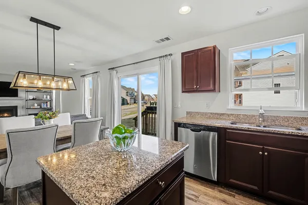 a kitchen with a table and chairs in it