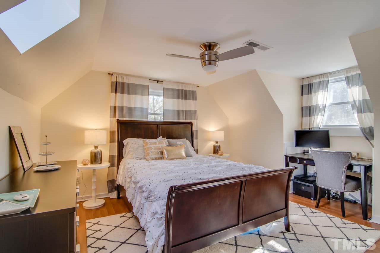 2704 Mt Vernon Church Road Raleigh, NC 27613 - Photo 13 of 23 a bedroom with a bed and wooden floor