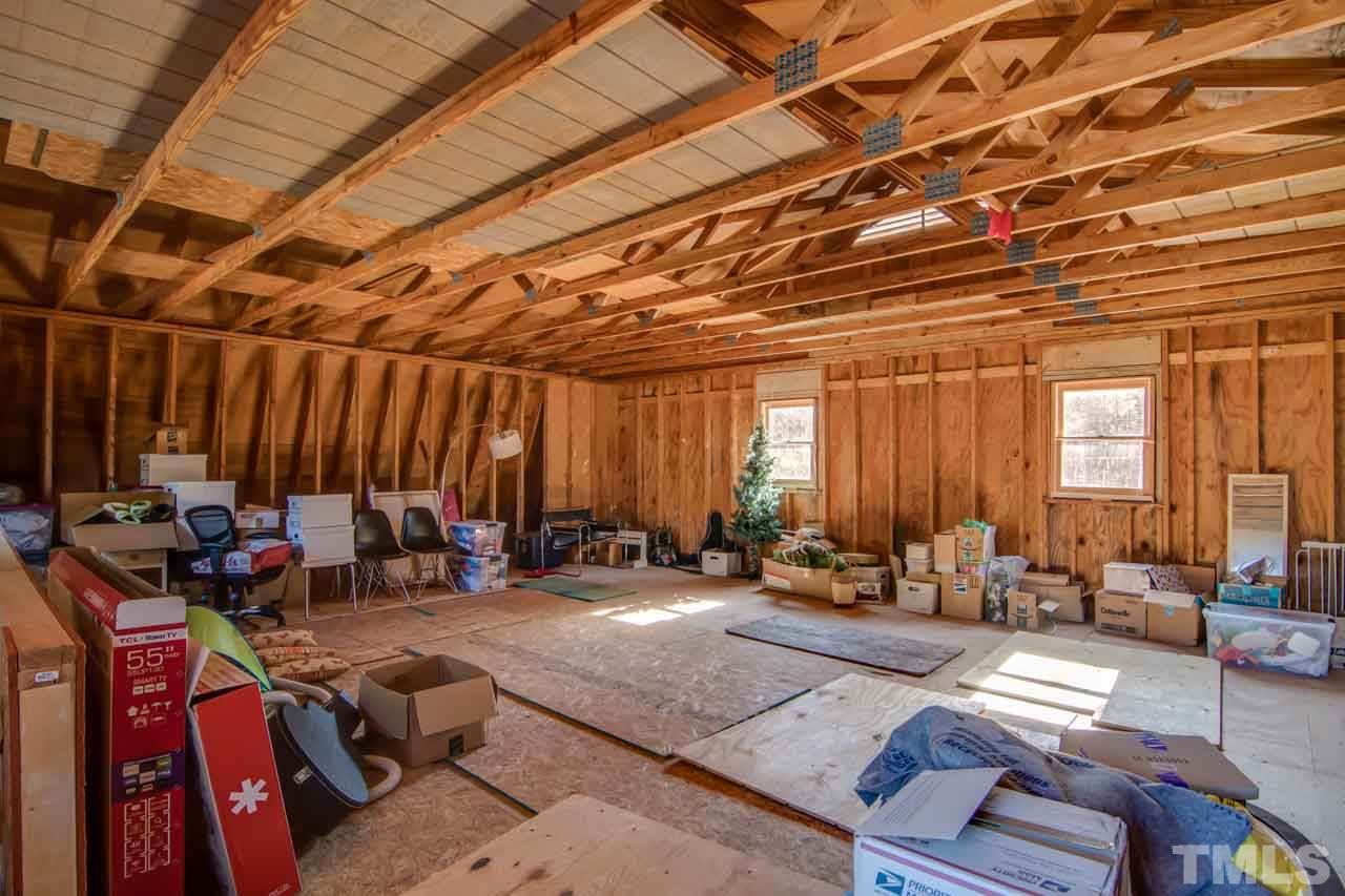 2704 Mt Vernon Church Road Raleigh, NC 27613 - Photo 20 of 23 a living room with lots of furniture and a chandelier