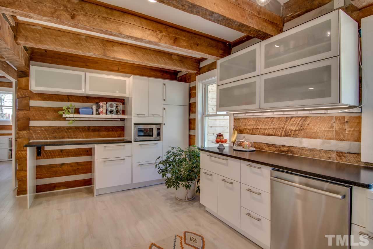 2704 Mt Vernon Church Road Raleigh, NC 27613 - Photo 6 of 23 a kitchen with stainless steel appliances granite countertop a sink and cabinets