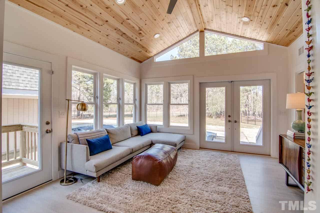 2704 Mt Vernon Church Road Raleigh, NC 27613 - Photo 7 of 23 a living room with furniture and a floor to ceiling window