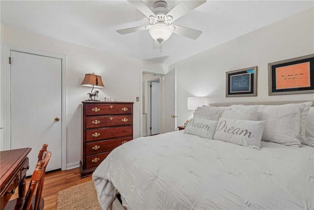 118 Conewanta Road Pittsburgh, PA 15241 - Photo 34 of 48 a bedroom with a bed and a chandelier