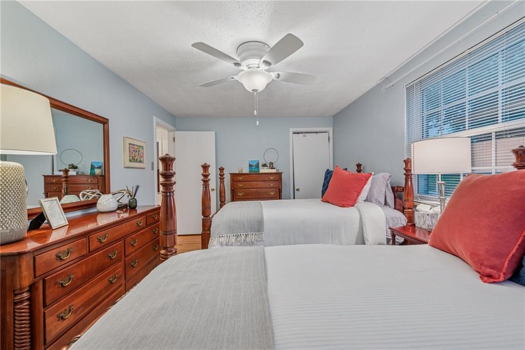 118 Conewanta Road Pittsburgh, PA 15241 - Photo 36 of 48 a bedroom with a bed and a chandelier