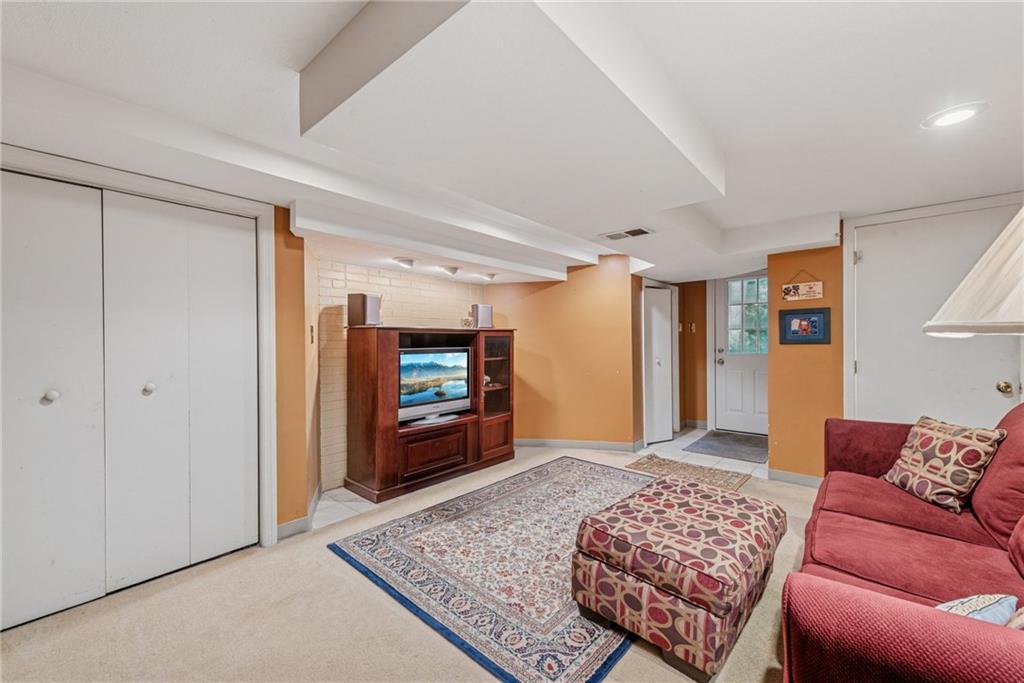 118 Conewanta Road Pittsburgh, PA 15241 - Photo 39 of 48 a living room with furniture and a rug