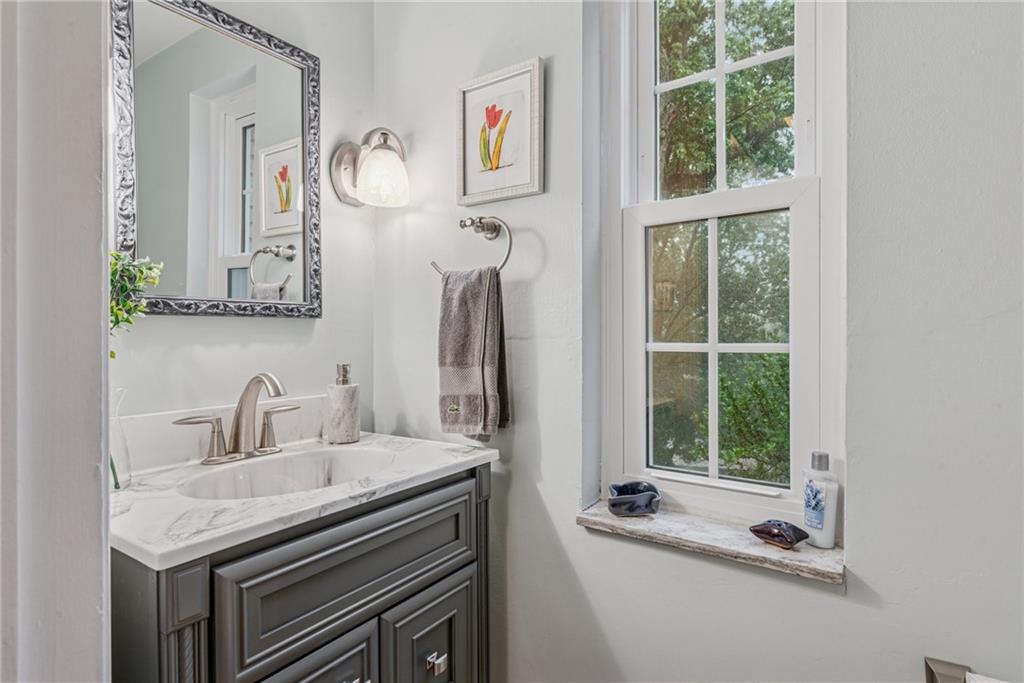 118 Conewanta Road Pittsburgh, PA 15241 - Photo 42 of 48 a bathroom with a sink and a mirror