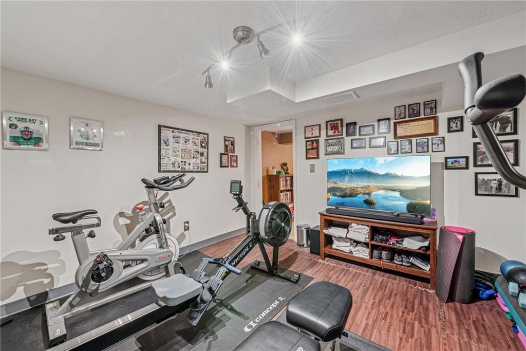 118 Conewanta Road Pittsburgh, PA 15241 - Photo 44 of 48 a room with gym equipment and windows