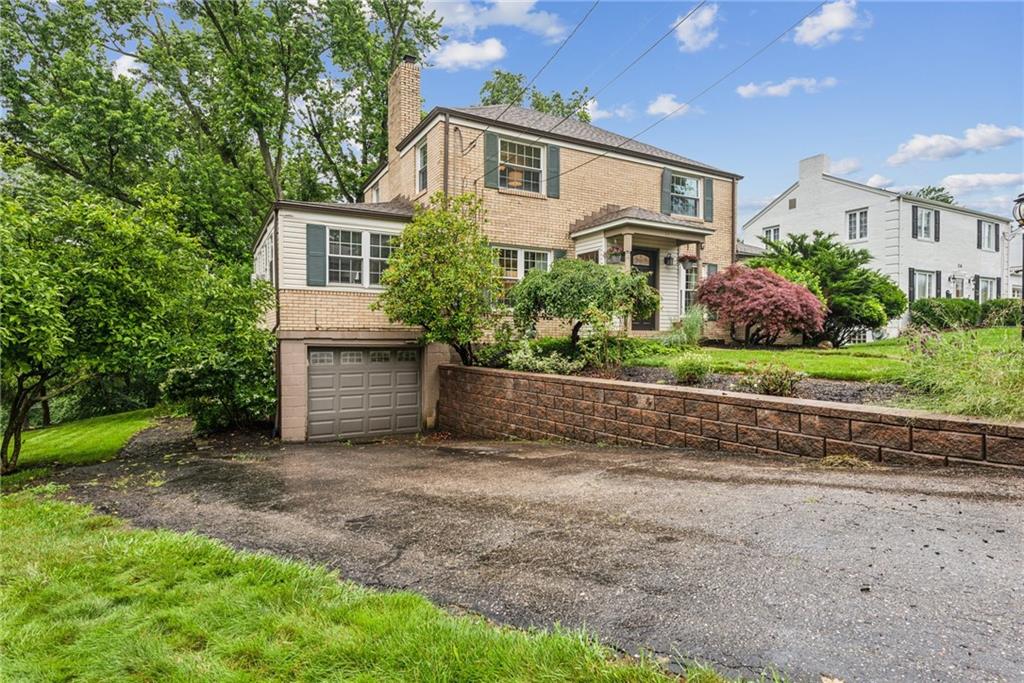 118 Conewanta Road Pittsburgh, PA 15241 - Photo 6 of 48 a front view of a house with a yard and garage