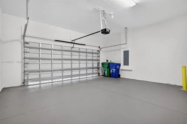 a kitchen with a refrigerator sink and microwave