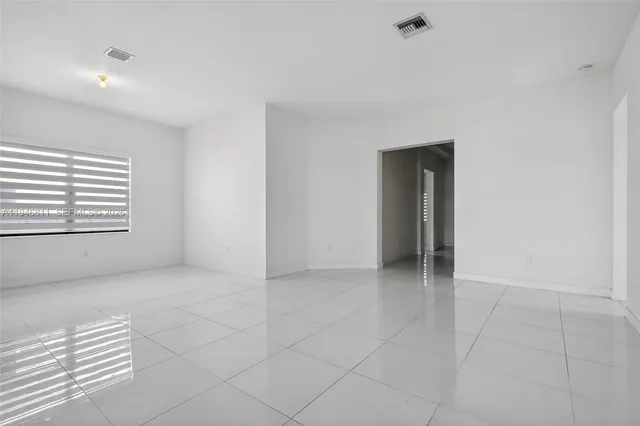 a kitchen with granite countertop a stove and a sink