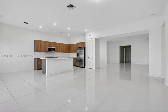 a view of a garden with houses in the background