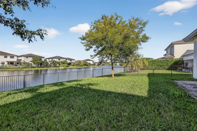 a bathroom with a shower sink and mirror